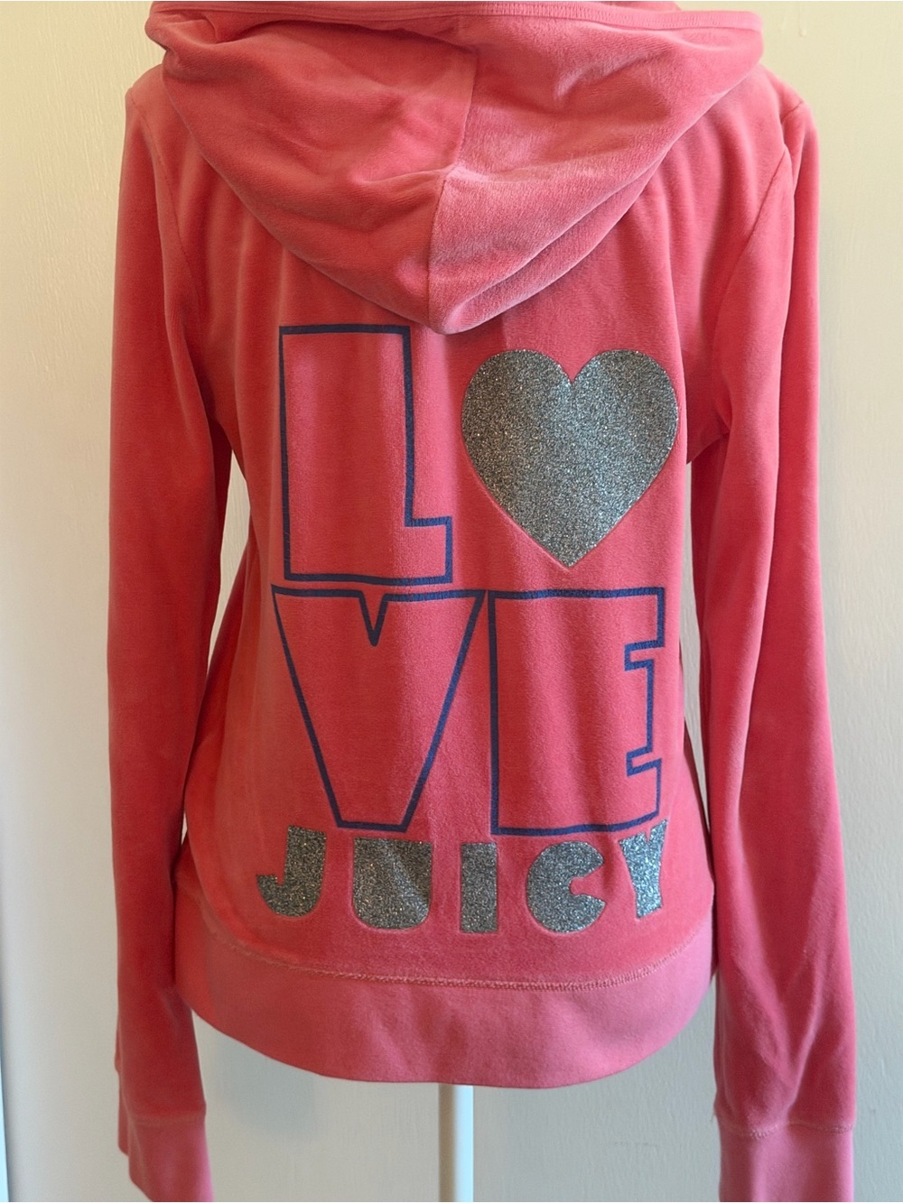 Juicy Couture pink zip up hoodie with silver glitter heart and love design.